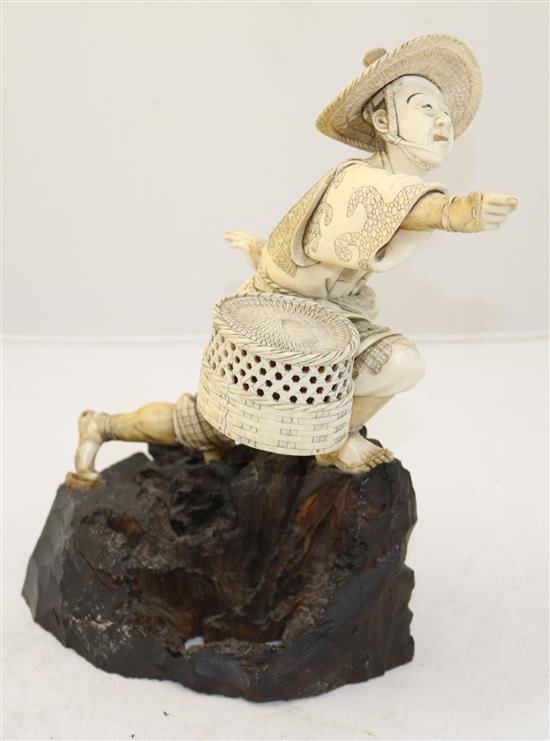 A Japanese sectional ivory figure of a fisherman, Meiji period, height 26.8cm, rod lacking